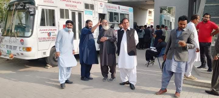 Daar E Khair team with police public service vehicles
